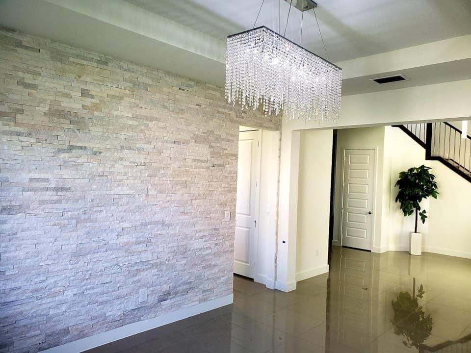 Stacked stone veneer accent wall in a modern living space